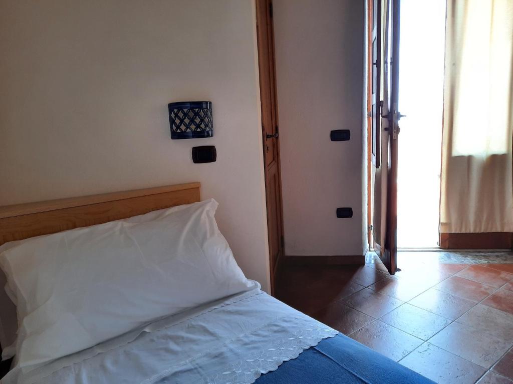 Postel nebo postele na pokoji v ubytování Portico Del Paradiso