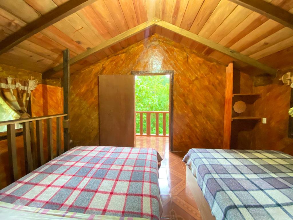 Postel nebo postele na pokoji v ubytování Cabañas los Cedros