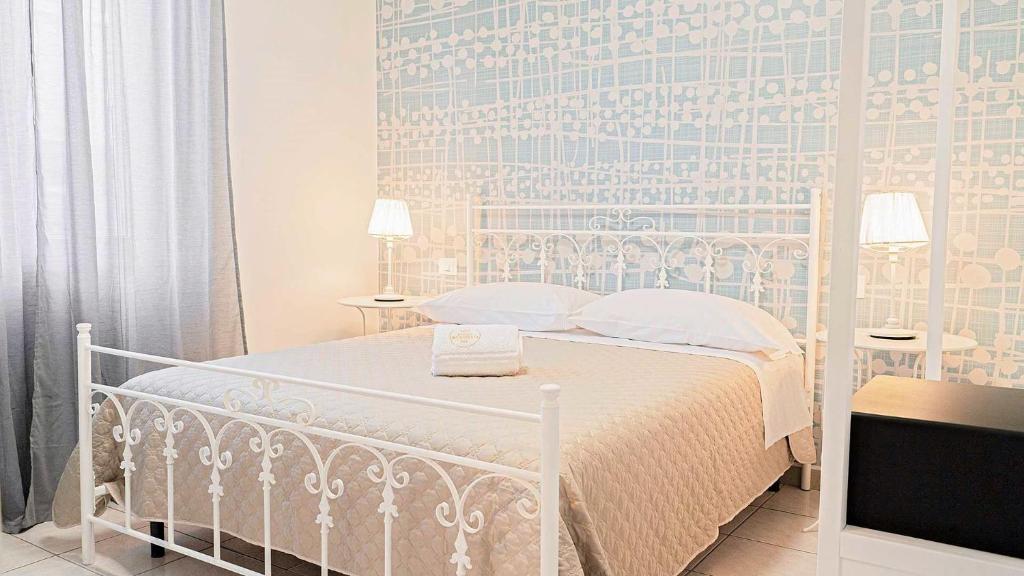 Postel nebo postele na pokoji v ubytování Borgo Incoronata B&B