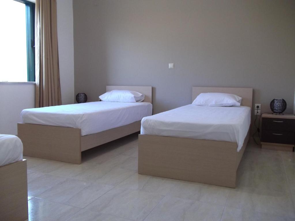 Posteľ alebo postele v izbe v ubytovaní Kritamos Beach Apartments