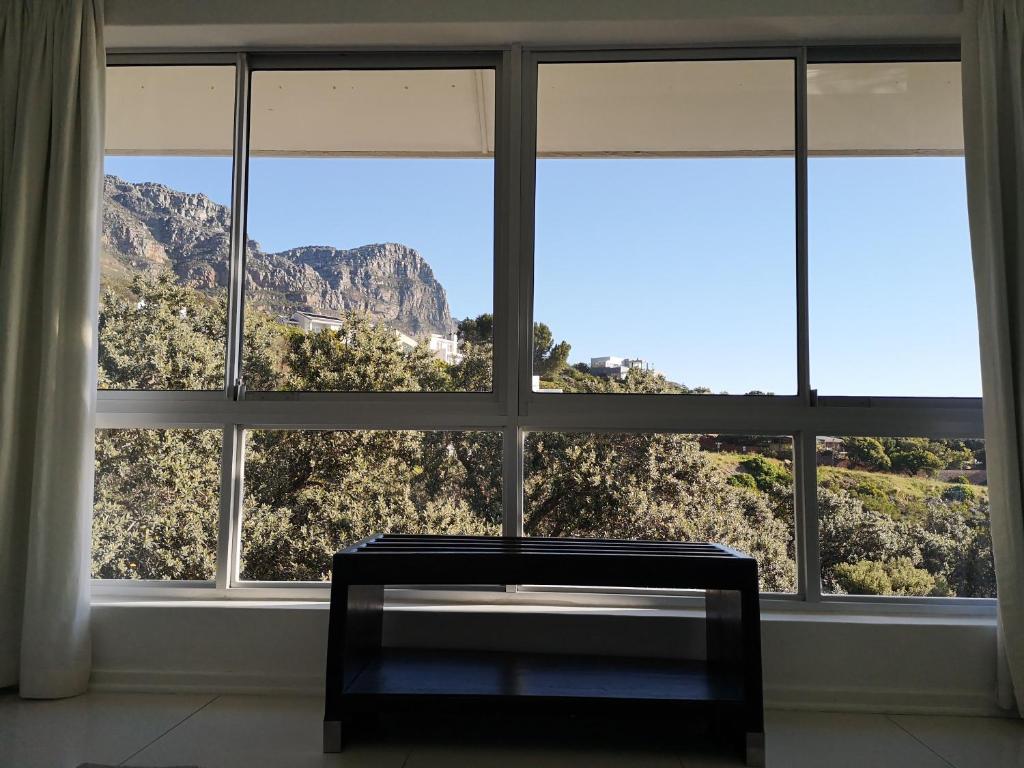 a large window with a view of a mountain at Diamond House Guesthouse in Cape Town