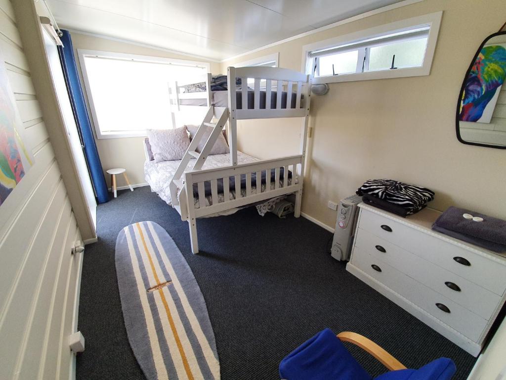 Postel nebo postele na pokoji v ubytování Stanmore Bay Beach House