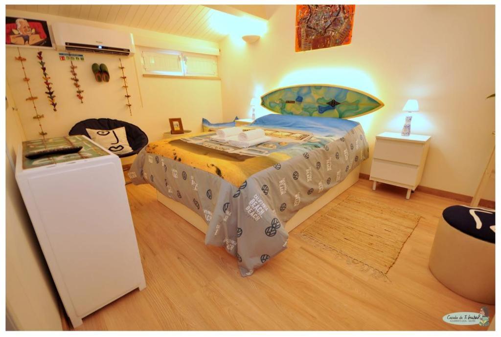 Кровать или кровати в номере Casinha da Ti Babel