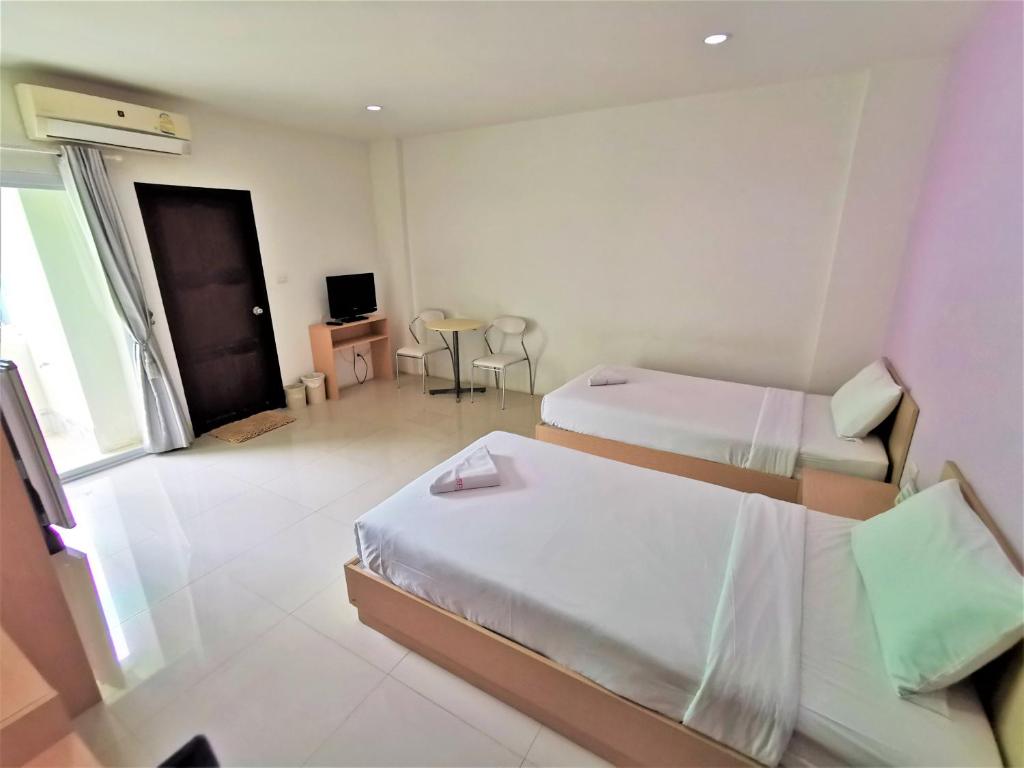 Postel nebo postele na pokoji v ubytování Hua Hin Irooms