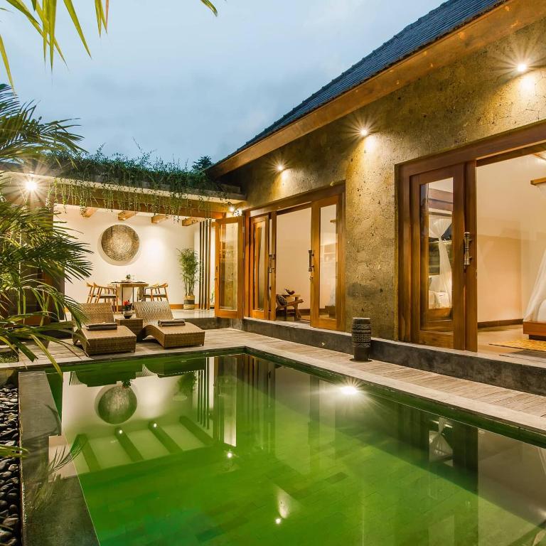 an image of a house with a swimming pool at Ubud Season Villas in Ubud