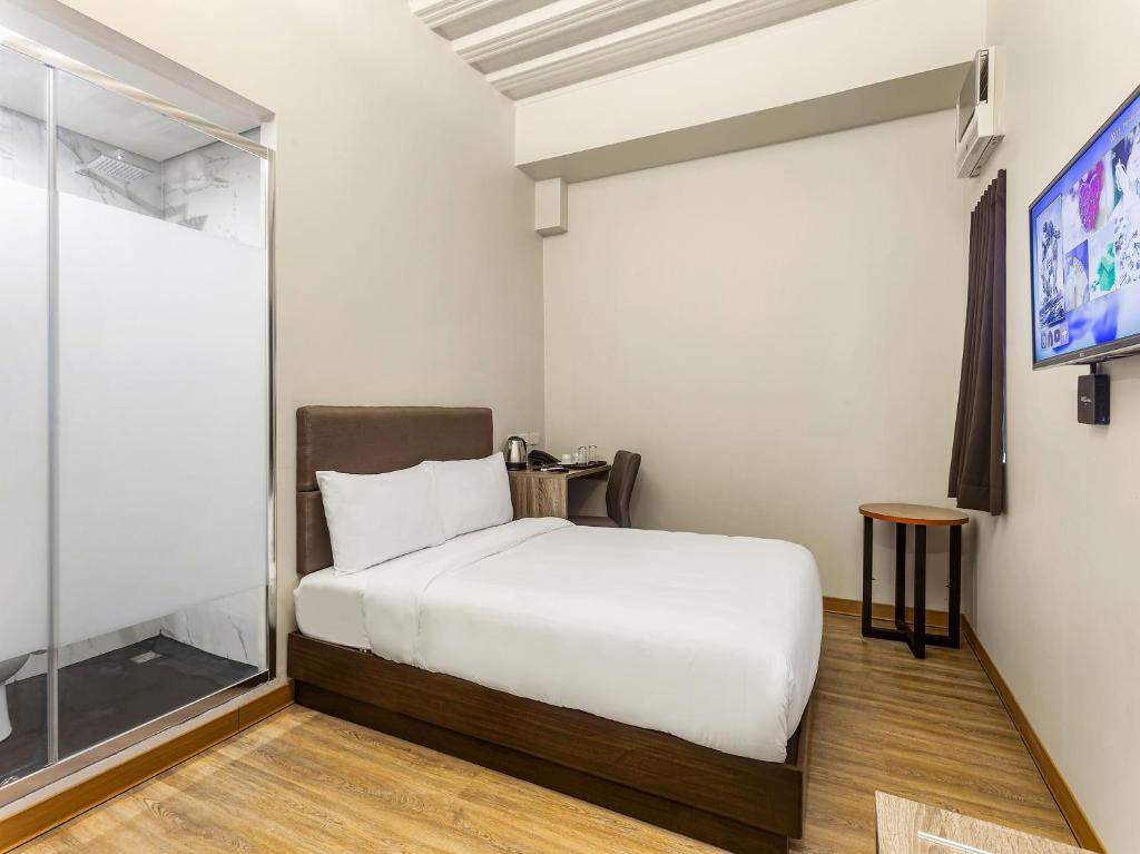 Postel nebo postele na pokoji v ubytování Airo Hotel Manila