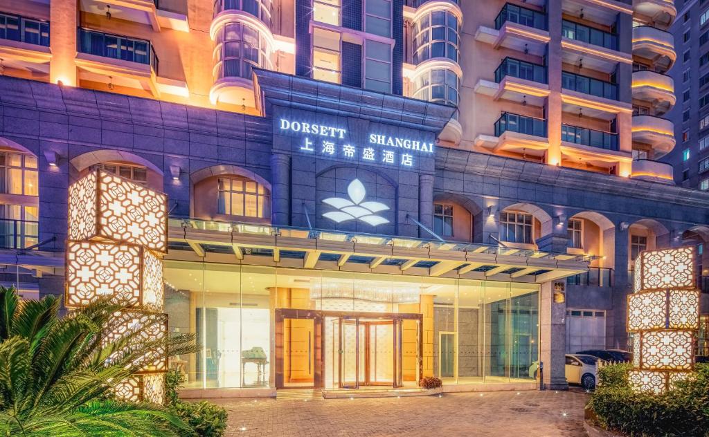 a facade of a building with the dassault siam hotel at Dorsett Shanghai in Shanghai