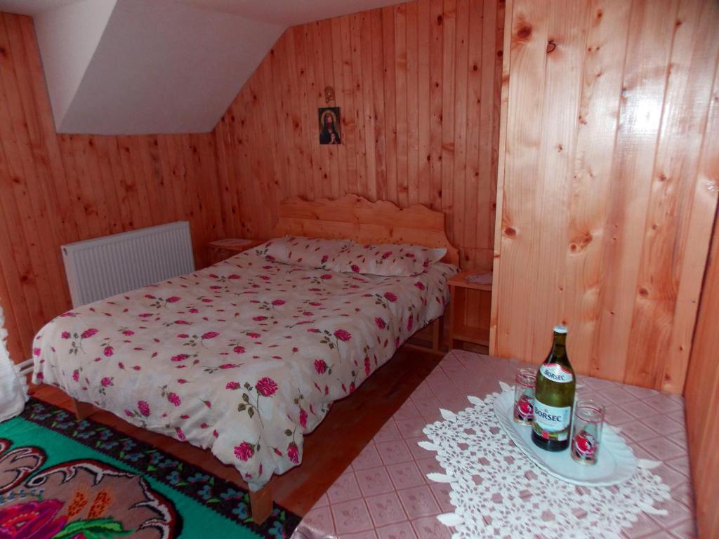Postel nebo postele na pokoji v ubytování Pensiunea Paradiso