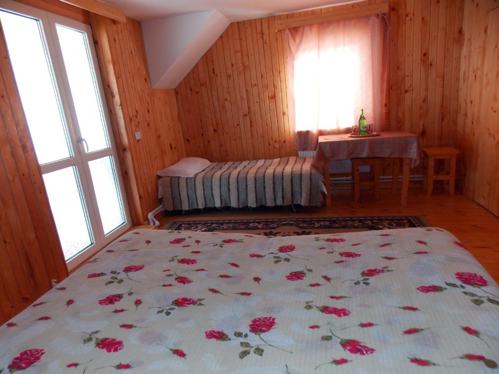 Postel nebo postele na pokoji v ubytování Pensiunea Paradiso