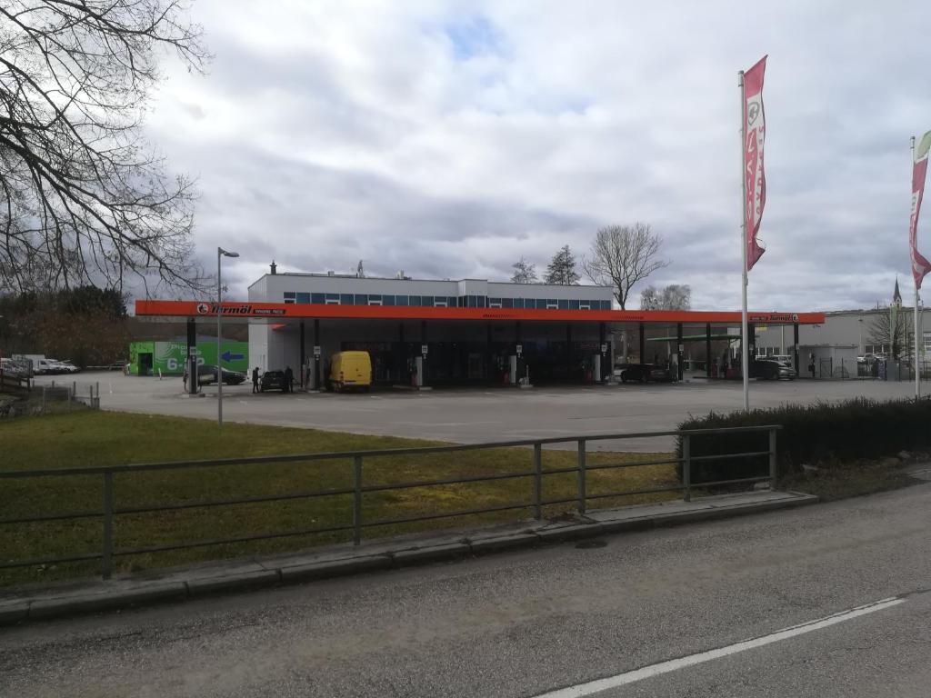 a gas station in front of a parking lot at Turmöl Hotel in Allhaming