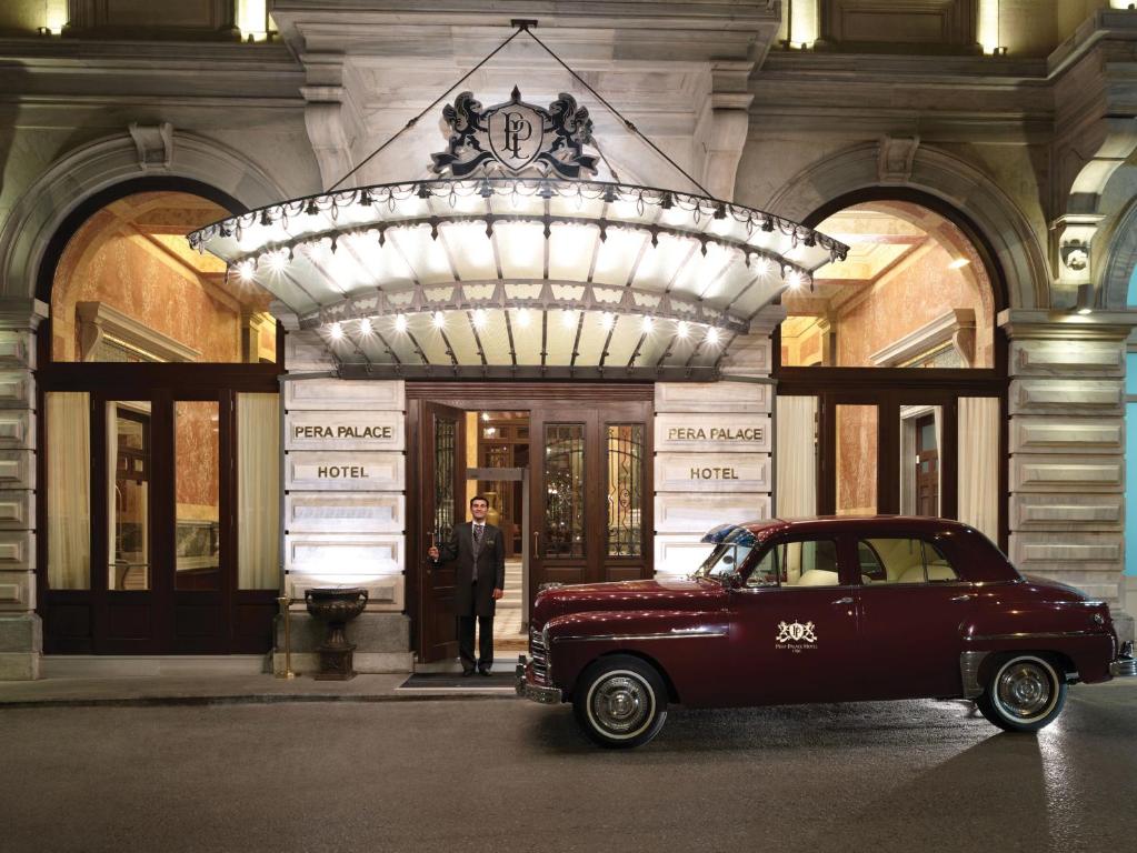 a car parked in front of a large building at Pera Palace Hotel in Istanbul