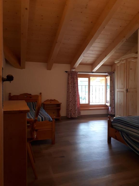 Posteľ alebo postele v izbe v ubytovaní Agritur Rizzi di Inama Ugo