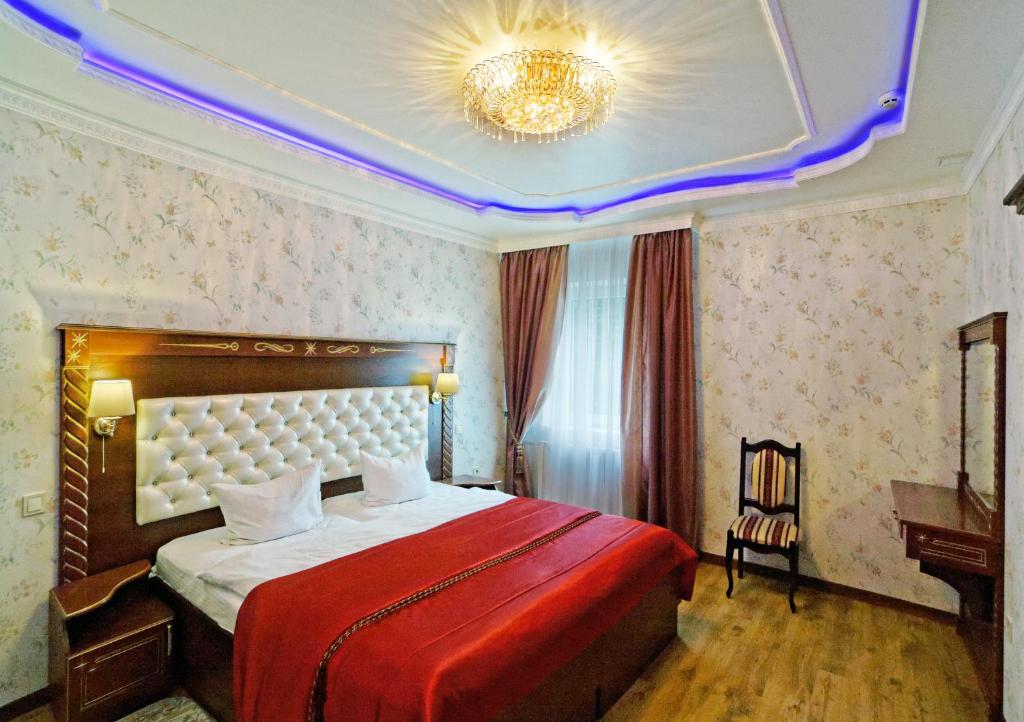 Postel nebo postele na pokoji v ubytování VICTOR Hotel Resort & SPA