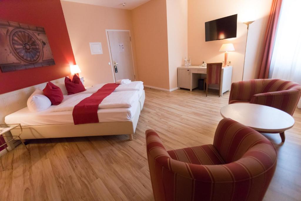 Postel nebo postele na pokoji v ubytování martas Hotel Albrechtshof Berlin