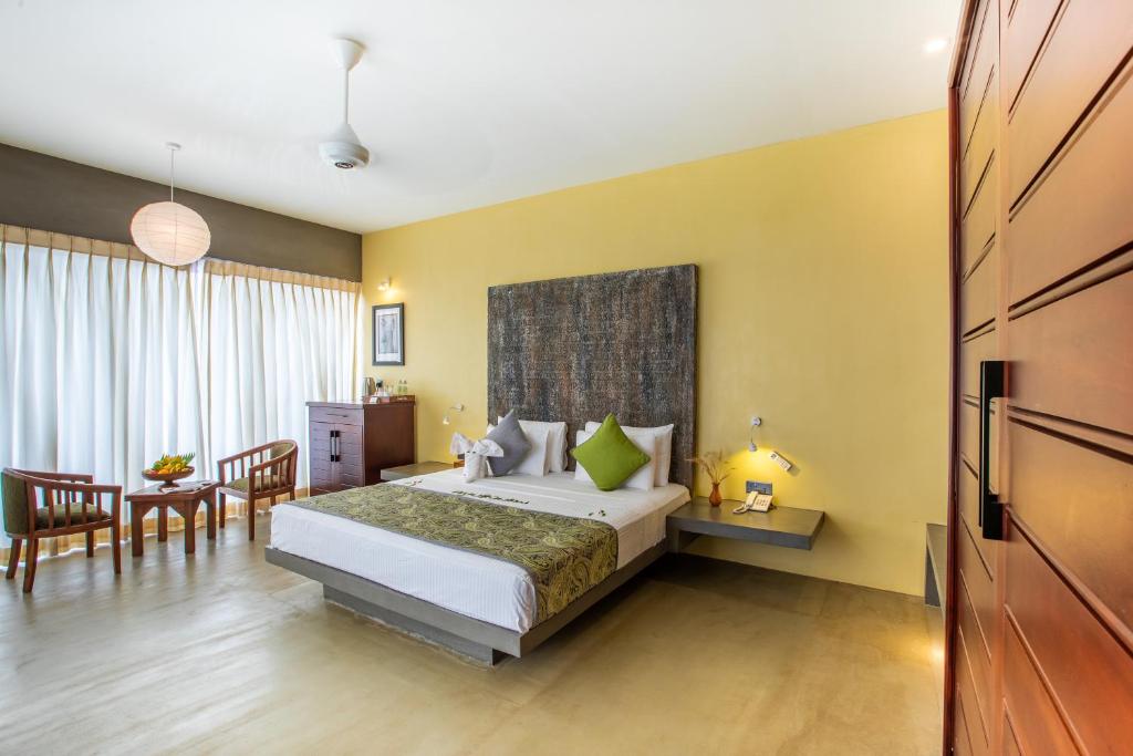 Postel nebo postele na pokoji v ubytování Sigiriya King's Resort
