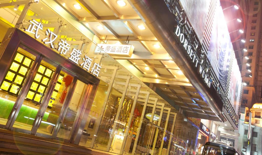 a store front of a building with signs on it at Dorsett Wuhan in Wuhan