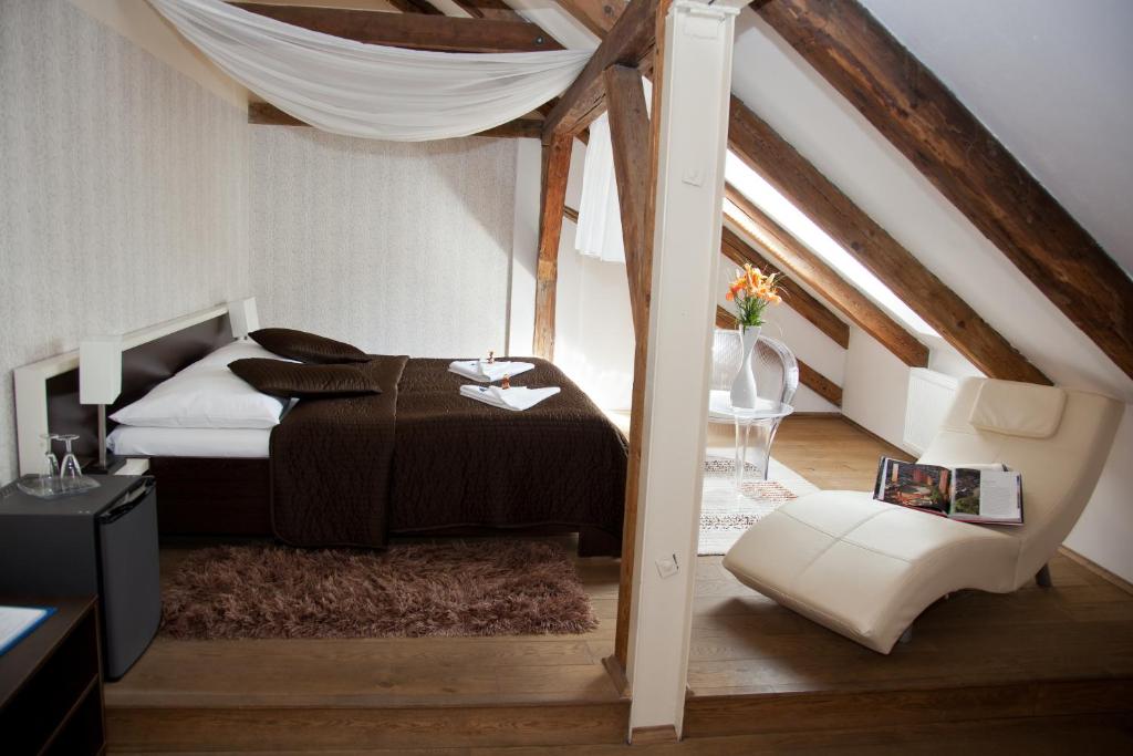 Postel nebo postele na pokoji v ubytování Hotel Peregrin