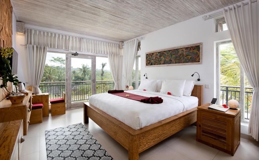 Postel nebo postele na pokoji v ubytování Abian Taksu Suite & Villas