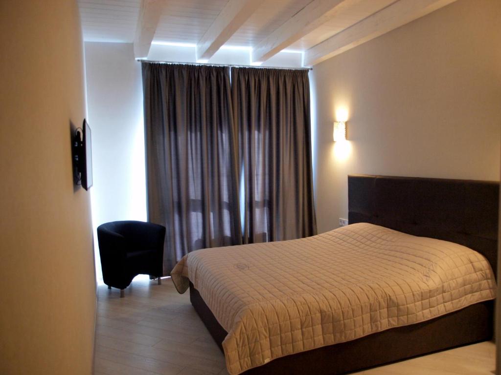 Postel nebo postele na pokoji v ubytování Hotel Nika 2