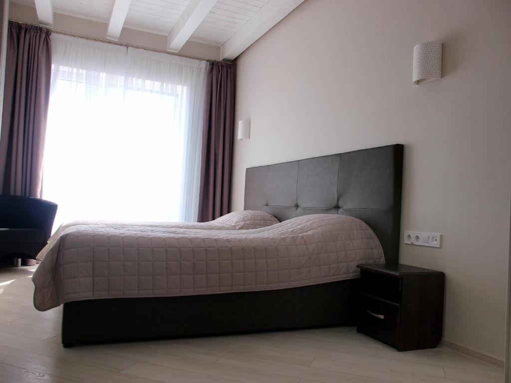 Postel nebo postele na pokoji v ubytování Hotel Nika 2