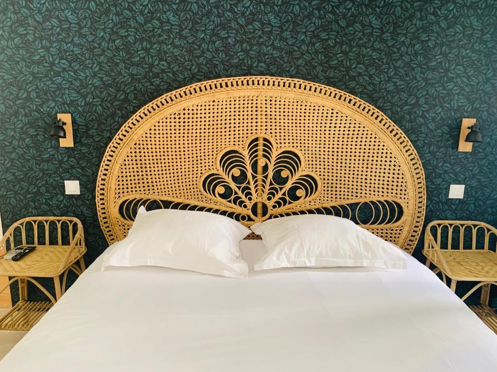 Postel nebo postele na pokoji v ubytování Hôtel Central
