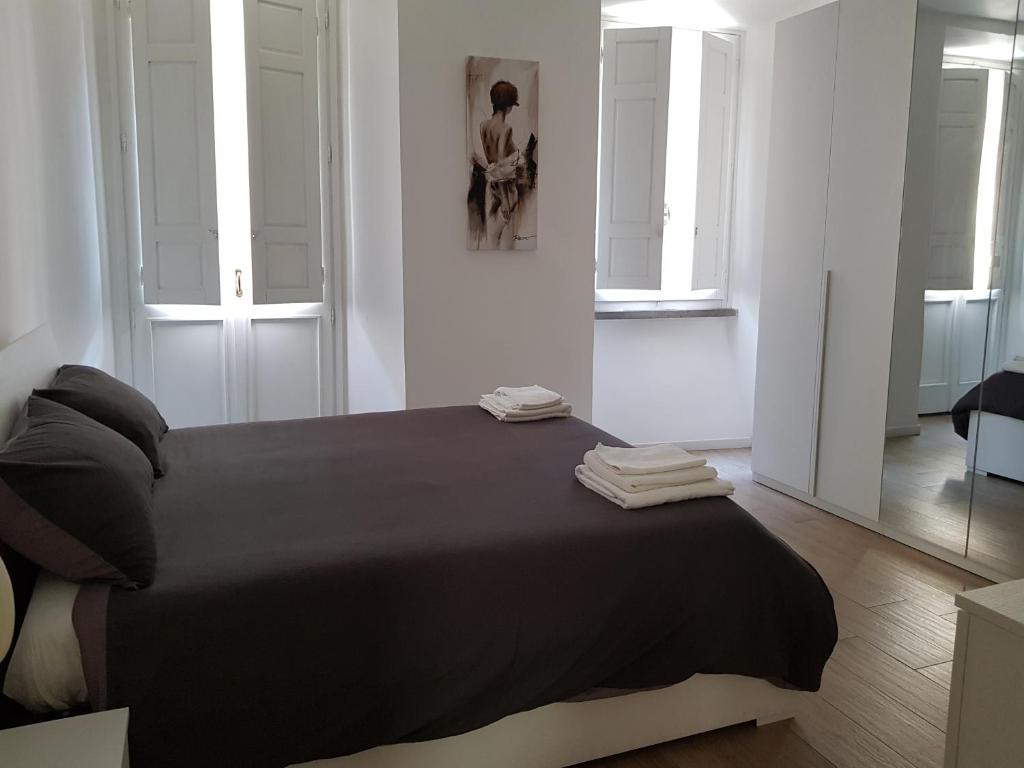 A bed or beds in a room at APARTMENT VITERBO CENTRO CORSO