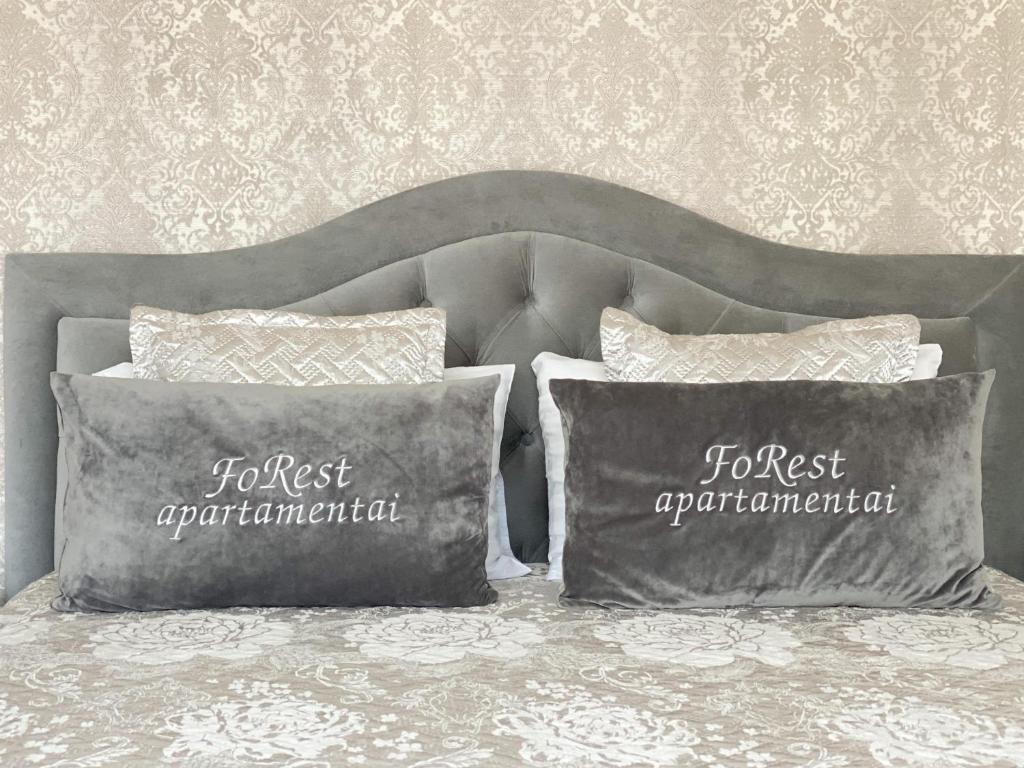 Postel nebo postele na pokoji v ubytování FoRest Apartments