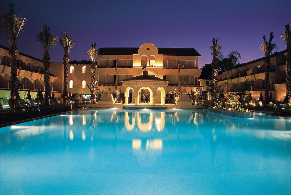 a large swimming pool in front of a building at Napa Plaza Hotel (Adults Only) in Ayia Napa