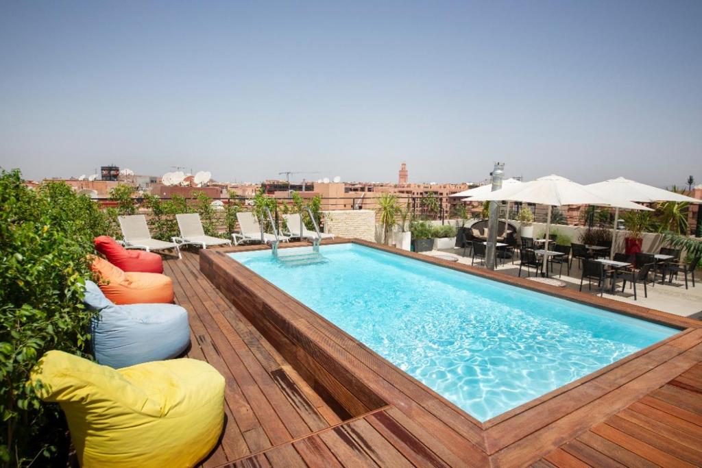 a swimming pool on top of a building at Hôtel Ibn Batouta in Marrakech