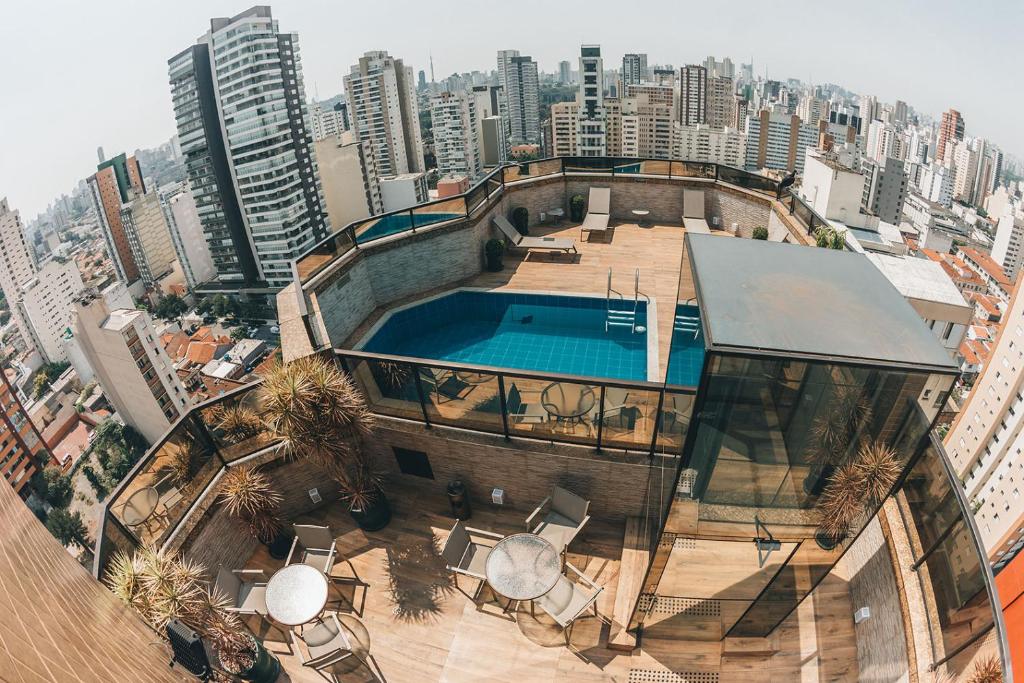 a large building with a lot of windows on top of it at Golden Tower Pinheiros by Fênix Hotéis in São Paulo