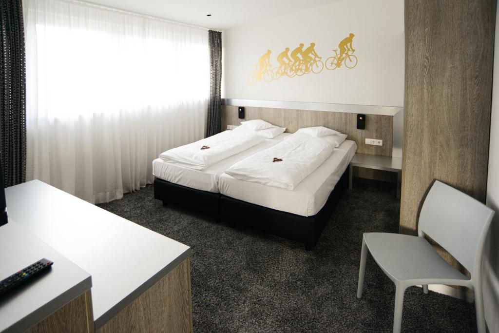 Postel nebo postele na pokoji v ubytování Boutique-Hotel im Weingarten