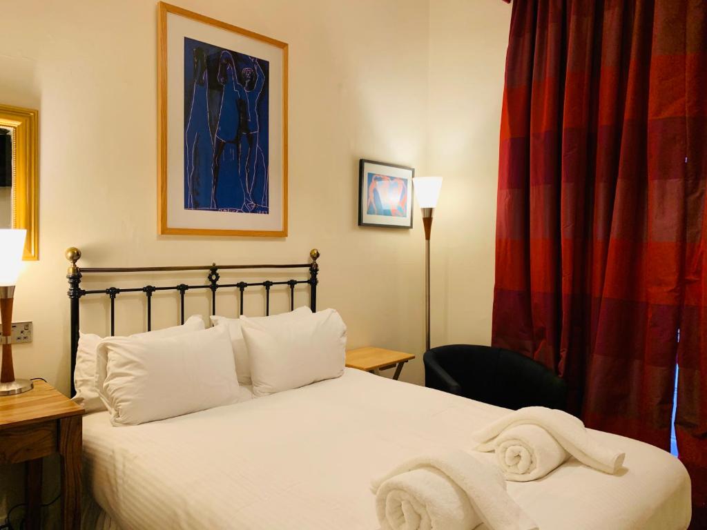 Postel nebo postele na pokoji v ubytování Southside Guest House