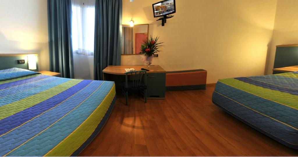 Postel nebo postele na pokoji v ubytování Hotel Vela