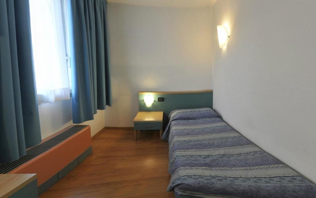 Postel nebo postele na pokoji v ubytování Hotel Vela