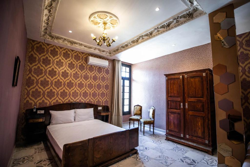 Postel nebo postele na pokoji v ubytování Palais Shazam & SPA