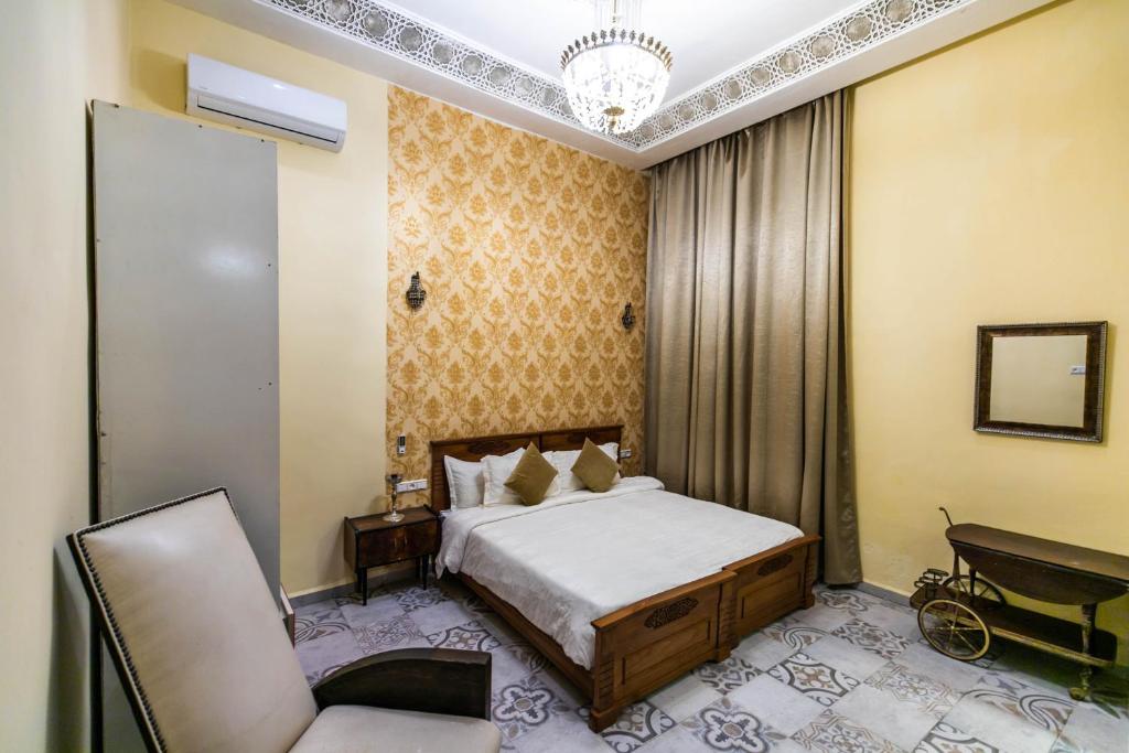 Postel nebo postele na pokoji v ubytování Palais Shazam & SPA