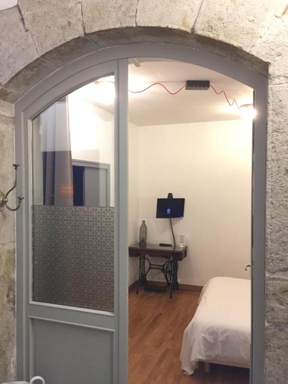 Postel nebo postele na pokoji v ubytování Hôtel Le Boulevardier