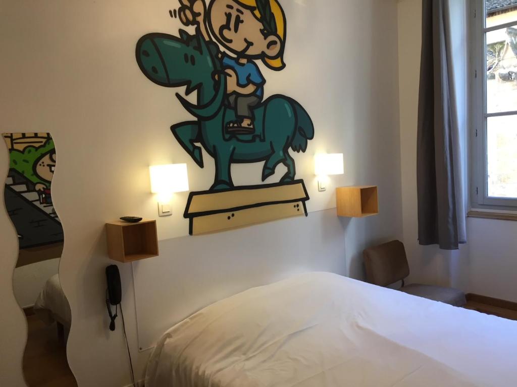 Postel nebo postele na pokoji v ubytování Hôtel Le Boulevardier