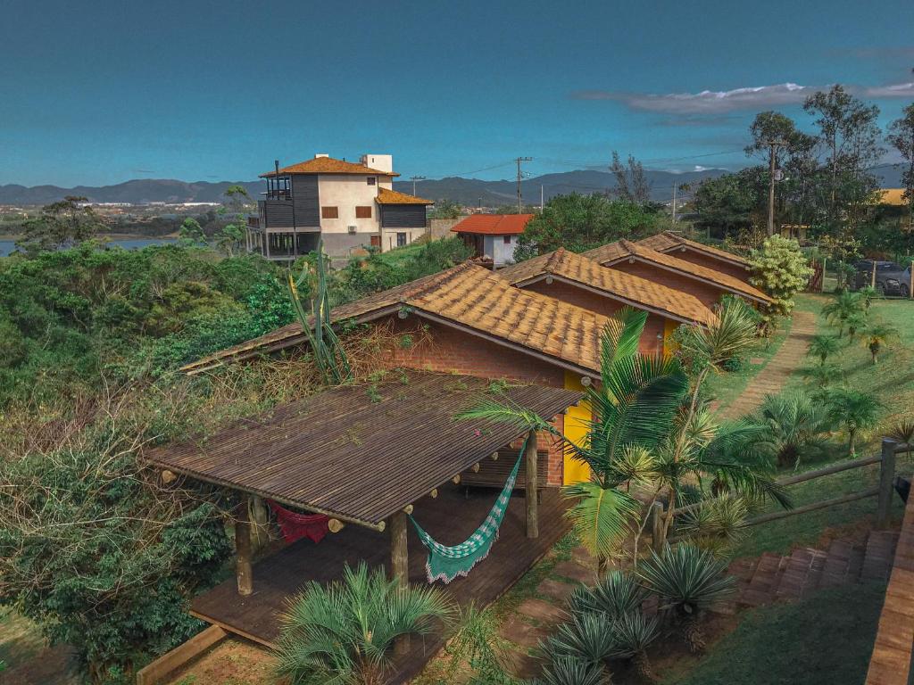 an overhead view of a house with a roof at Doce Cabana Pousada in Barra de Ibiraquera