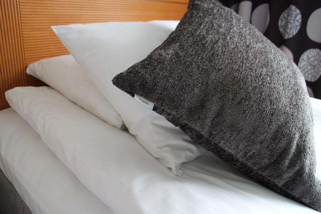 Postel nebo postele na pokoji v ubytování Arena Hotell