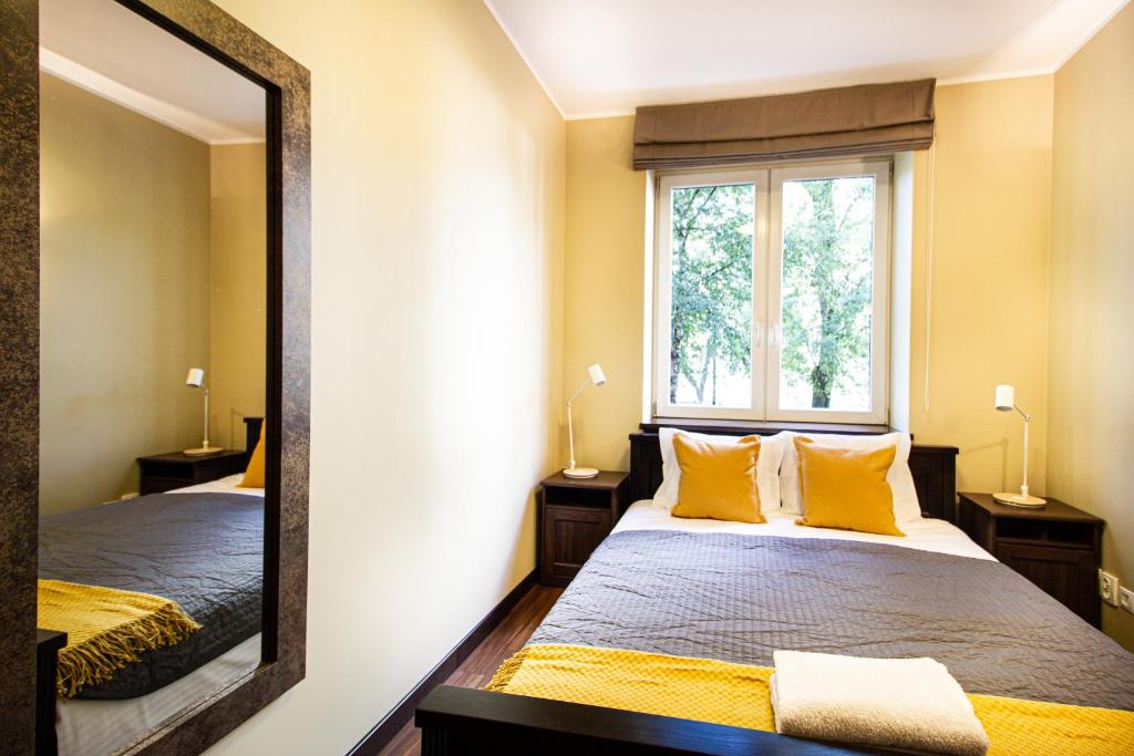 Posteľ alebo postele v izbe v ubytovaní Plac Zbawiciela Elegant Apartment