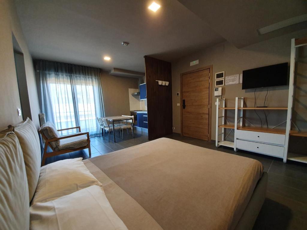 Posteľ alebo postele v izbe v ubytovaní Dannunziano Aparthotel