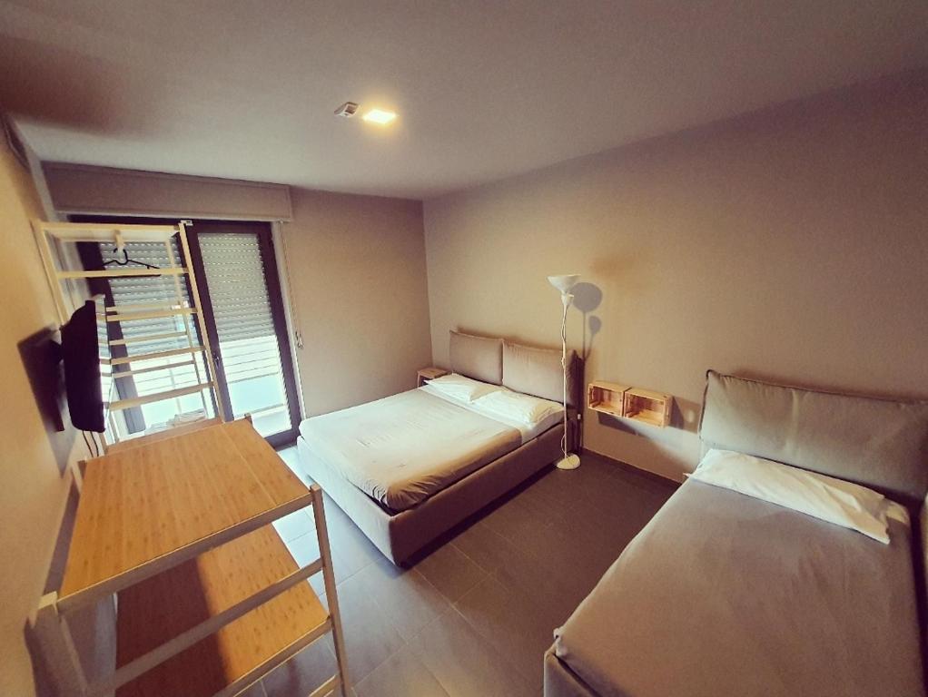 Posteľ alebo postele v izbe v ubytovaní Dannunziano Aparthotel