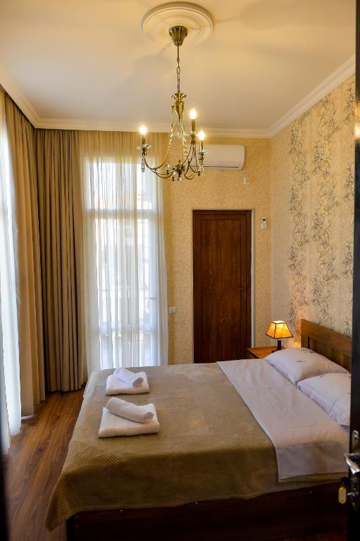 Postel nebo postele na pokoji v ubytování Gold Guest House