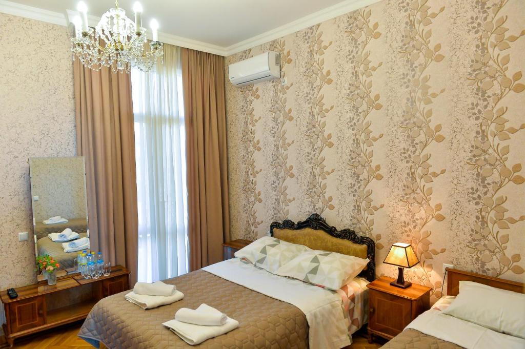 Postel nebo postele na pokoji v ubytování Gold Guest House