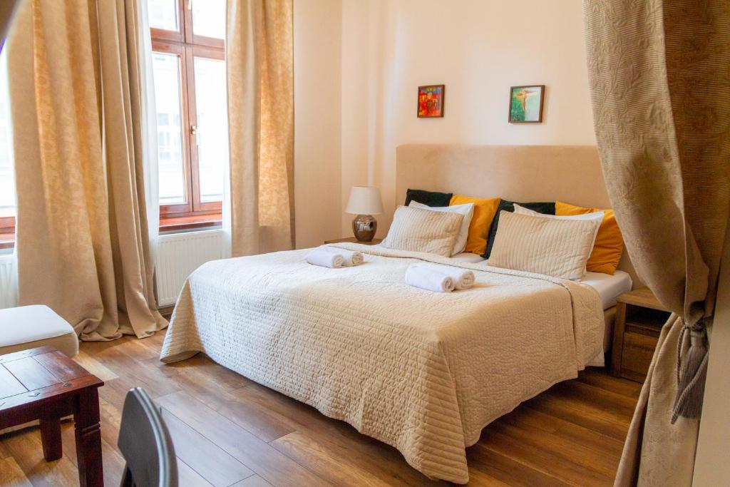 Posteľ alebo postele v izbe v ubytovaní Lounge Apartments