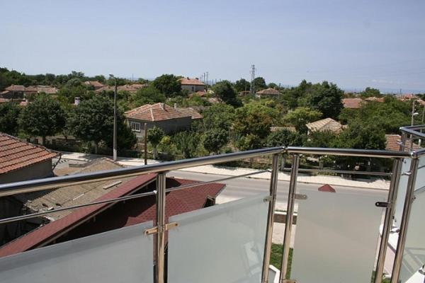 a view of a city from the balcony of a house at Hotel Akre in Kavarna