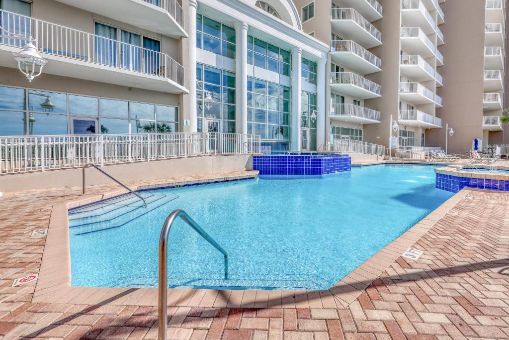 a large swimming pool in front of a building at Majestic Sun A in Destin