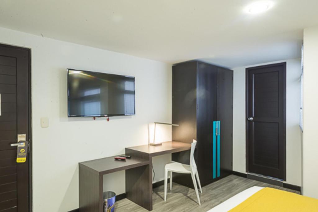 TV a/nebo společenská místnost v ubytování Hotel City Bog Usaquén