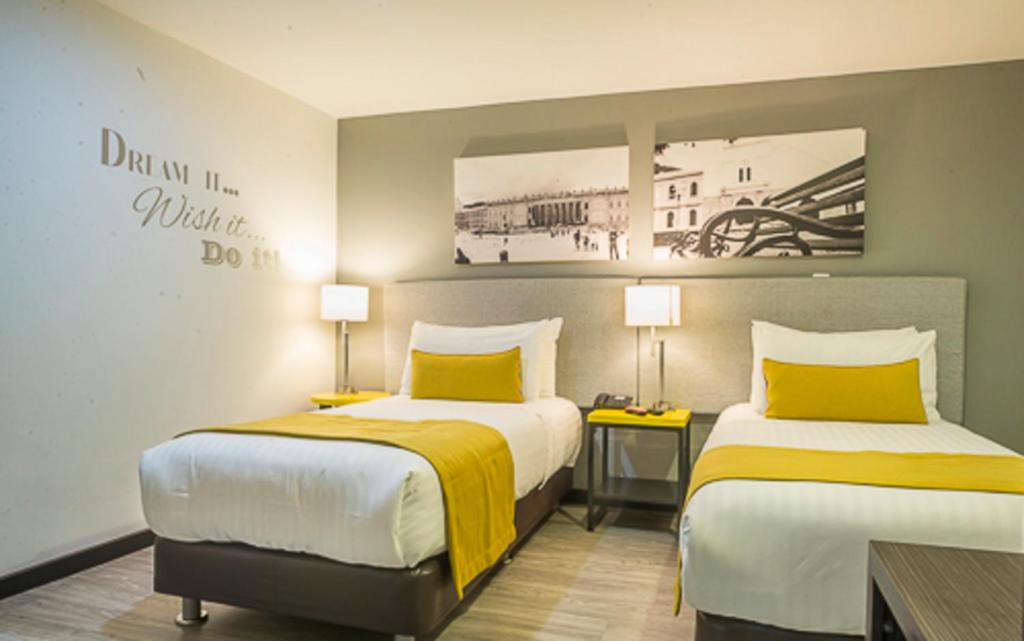 Postel nebo postele na pokoji v ubytování Hotel City Bog Usaquén